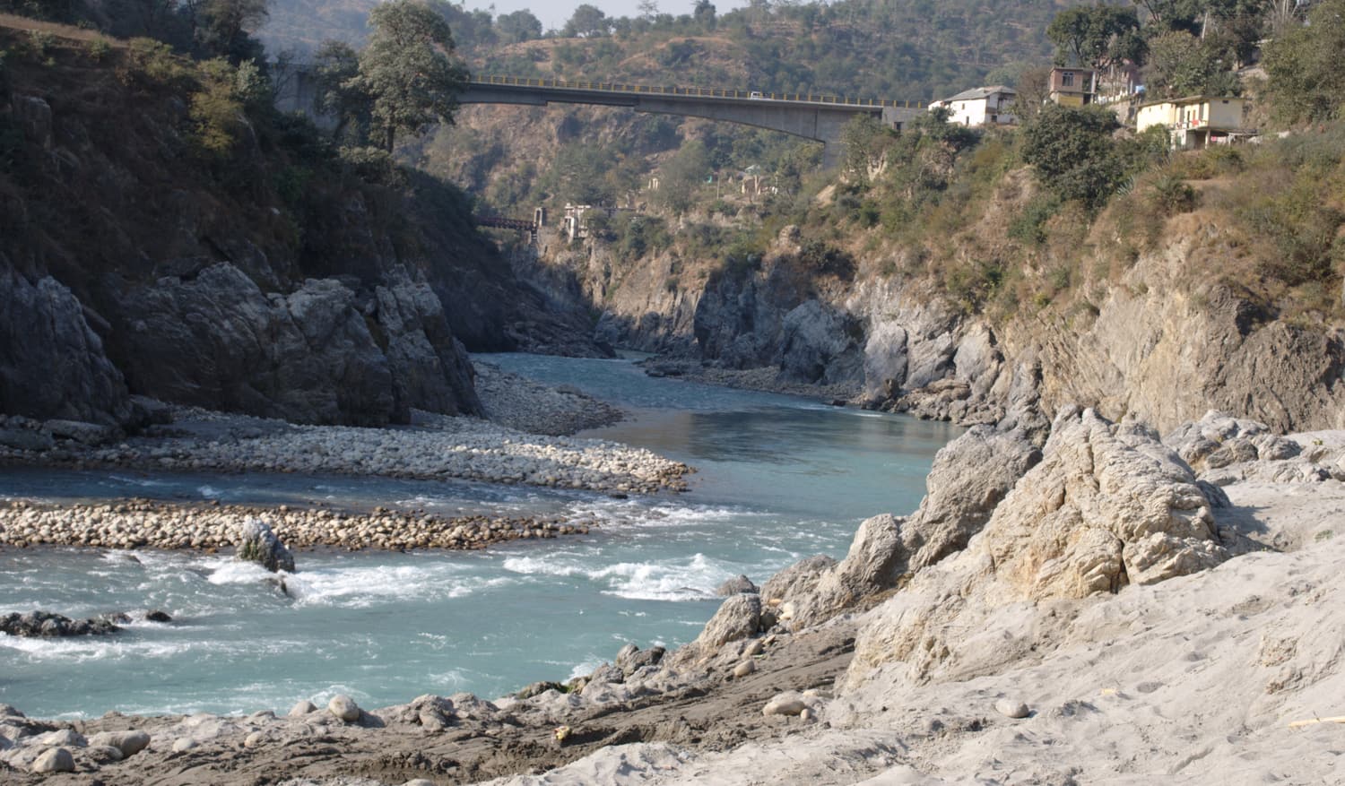 The Sutlej river gorge at Tattapani with a footbridge and riverside buildings