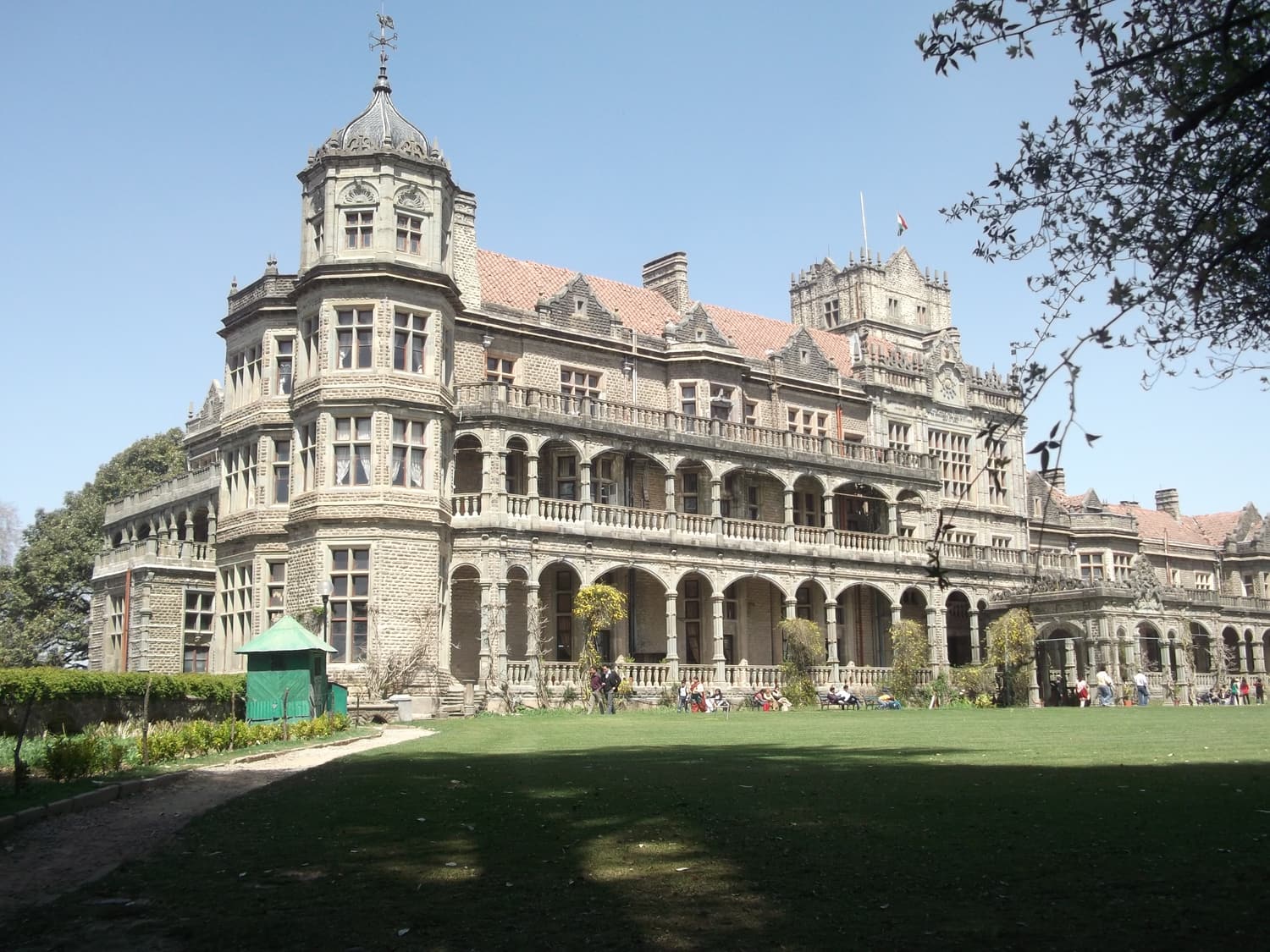 The Viceregal Lodge in Shimla, a grey-stone mansion with towers and a broad lawn