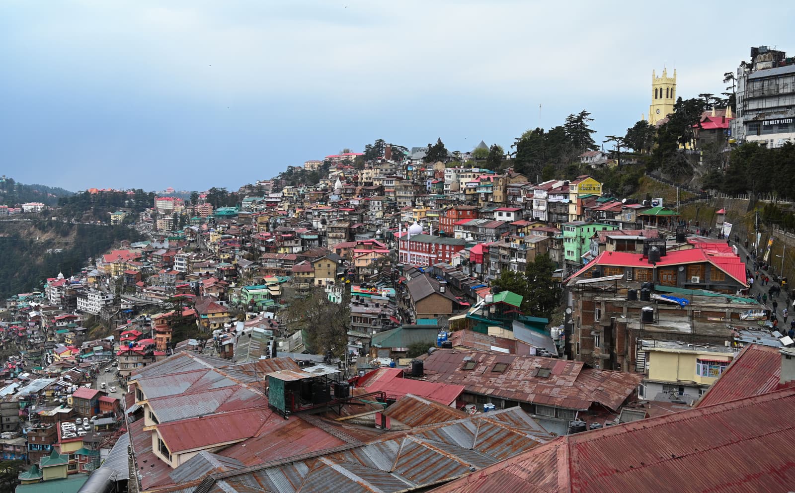 The houses of Shimla stacked up a steep hillside